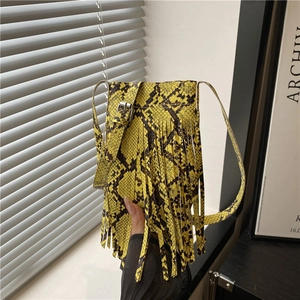 Neon yellow snakeskin mini crossbody bucket bag with fringe tassels and metal buckle