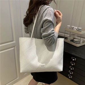 Large white woven tote bag for women showing spacious interior and fashion tag