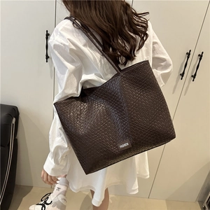 Large dark brown woven tote bag for women featuring a minimalist fashion shoulder strap