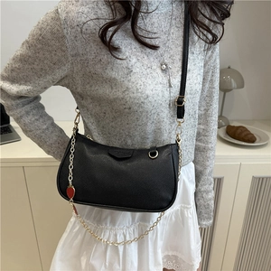 Chic black lychee grain crescent hobo bag with gold chain and strawberry charm