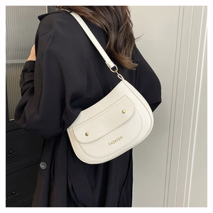 Detail of white lychee leather crescent bag with fashion logo and gold stud pocket detail