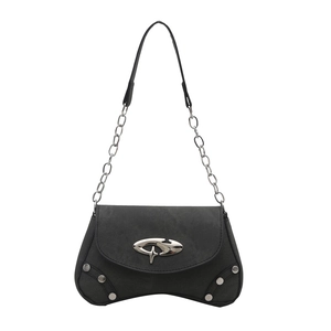 Y2K style black shoulder bag with silver studs and star buckle on white background