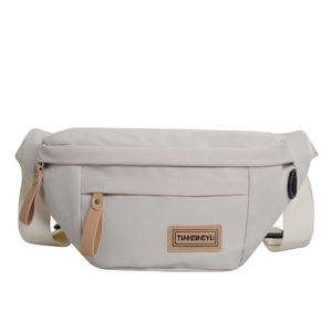 Waterproof nylon crossbody bag in beige with large capacity for travel and leisure