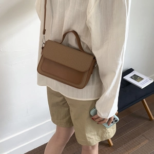 Chic brown textured woven and leather crossbody bag with silver hardware for women