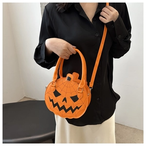 Detail of pumpkin-shaped PU leather crossbody bag with black Jack-o'-lantern face embroidery