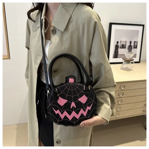 Fashionable pumpkin shoulder bag with pink spider web and ghost face for Halloween style