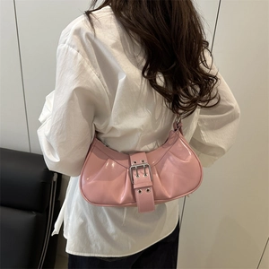 Pink Y2K style pleated underarm bag with silver buckle and grommets on shoulder strap