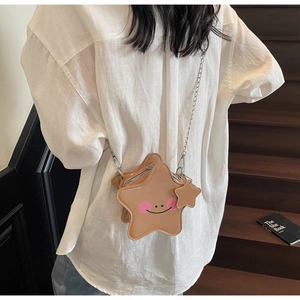 Star-shaped light brown leather crossbody bag with smile graffiti and silver chain