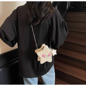 Star-shaped crossbody bag with smiley face and chain strap shown from back view