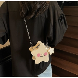 Star-shaped mini crossbody bag with a cute smiley face and silver metal chain strap