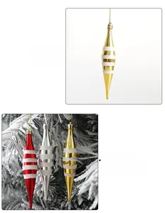 Detail of icicle-shaped Christmas tree ornaments with white glitter stripes and metallic finish