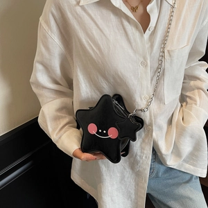Black star shaped crossbody bag with cute face design and silver chain strap