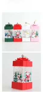Detailed view of square Christmas lanterns with bow toppers and festive holiday prints