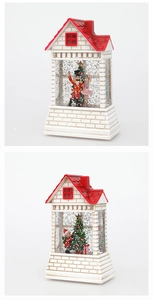 Detail of Christmas lantern house with glitter water, nutcracker, and holiday tree scene