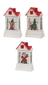 Detailed view of three Christmas water house lanterns with glitter snow and holiday scenes