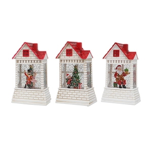 Three Christmas snow globe houses with Santa, nutcracker, and snowman scenes