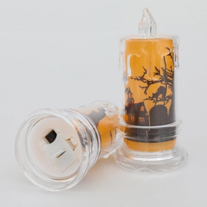 Candela LED di Halloween arancione con silhouette di castello nero e base bianca