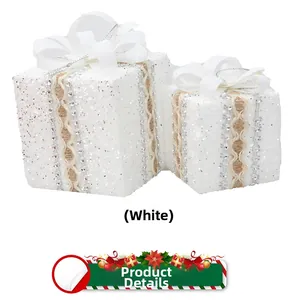 Detail of white Christmas gift box ornaments with lace trim and silk bows