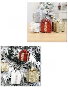 Close-up of glittery Christmas gift box ornaments with lace bows for tree decoration