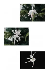 Detail of shimmering white ballet girl Christmas hanging ornaments with fairy wings
