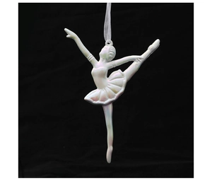 Close-up of a pearlescent ballet girl ornament for Christmas trees with a silk ribbon