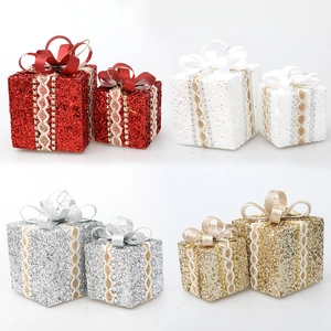 Glittering Christmas gift box ornaments with elegant lace trim and ribbon bows