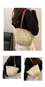 Detail view of woven tote bag with lace stitching and brown leather shoulder straps