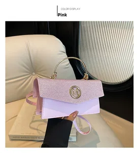 Close-up of pink sequin shoulder bag with golden metal M-logo and round ring handle