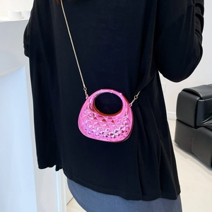 Mini acrylic cross-body bag with metallic pink quilted pattern and gold chain strap