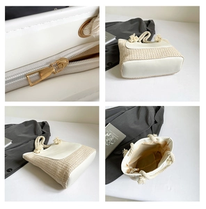 Detail view of woven straw tote bag with leather trim and metallic zipper closure