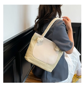 Detail of hand-woven tote bag with white leather panel and thick cotton rope strap