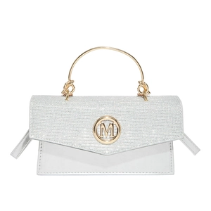 Silver glitter mini handbag with gold metal round handle and M logo on white background