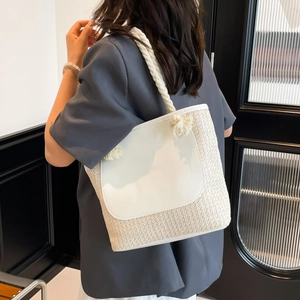 Chic cream woven bucket tote bag with white leather panel and rope handles on model