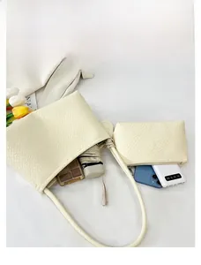 Top view of woven shoulder bag interior showing ample capacity for daily essentials