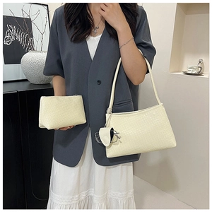 Detail of cream woven texture handbag set with shoulder bag and small zipper pouch