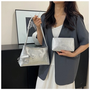 Detailed view of silver woven tote bag with matching pouch and glasses case accessory