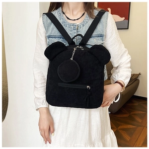 Detail of black corduroy backpack with cute bear ears and matching round coin purse