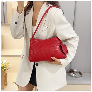 Detail of red woven leather shoulder bag with matching mini pouch and long strap