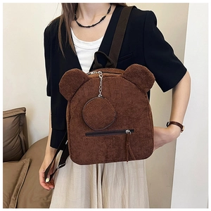 Detail of brown corduroy backpack with cute bear ears and matching coin purse