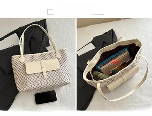 Interior view showing large capacity and cream leather trim of this checkered tote bag