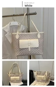 Detail of white large capacity tote bag with geometric print and front leather pocket