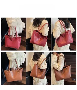 Detailed shots of red and brown woven large tote bag shown on a shoulder in vintage setting