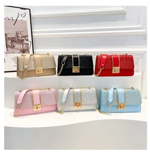 Detailed multi-color display of chain bags featuring glitter material and gold clasp