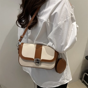 Chic cream herringbone crossbody bag with brown leather trim and a round coin purse
