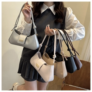 Detailed display of five colorful minimalist underarm bags with stylish knotted straps