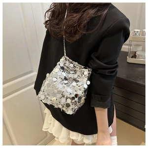 Silver sequin bucket bag with shiny mirror discs and delicate metallic chain shoulder strap
