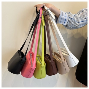 Collection of mini bucket bags in six vibrant colors with adjustable shoulder straps