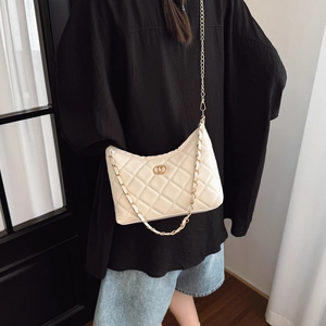 Chic cream quilted shoulder bag with gold hardware and chain strap for women