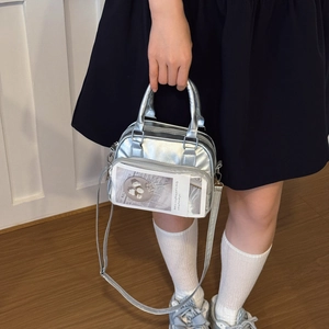 Silver metallic crossbody bag with clear display window and adjustable strap