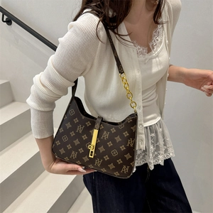 Vintage brown monogram underarm shoulder bag with gold metal buckle and leather chain strap